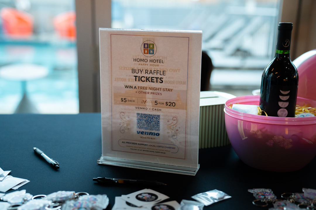 The raffle table sign, five dollars a ticket, every dollar for a local cause
